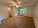 This is a bedroom with neutral carpet, a ceiling fan and two closets at 3013 Barcelona Way, Conyers, GA 30012