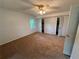 This carpeted bedroom has natural light and closet space at 3013 Barcelona Way, Conyers, GA 30012