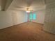 This carpeted bedroom features ample space and natural light at 3013 Barcelona Way, Conyers, GA 30012