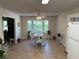 Bright dining area with a table set for four and a large window overlooking the backyard at 3013 Barcelona Way, Conyers, GA 30012