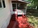 Exterior view of a deck with access to a screened-in porch and backyard at 3013 Barcelona Way, Conyers, GA 30012
