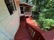 Exterior view of a deck and stairs leading to a screened porch at 3013 Barcelona Way, Conyers, GA 30012