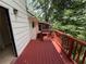 Exterior deck with red railings and access to the screened-in porch area at 3013 Barcelona Way, Conyers, GA 30012