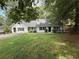 Charming single-story home with a well-maintained lawn and mature trees at 3013 Barcelona Way, Conyers, GA 30012