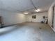 Spacious garage with ample lighting, utility hookups, and additional storage space at 3013 Barcelona Way, Conyers, GA 30012