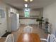 Spacious kitchen with white cabinets, appliances, and a window above the sink at 3013 Barcelona Way, Conyers, GA 30012