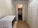 Laundry with folding door, washer and dryer behind closed doors at 3013 Barcelona Way, Conyers, GA 30012