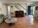 The living room offers hardwood floors and plenty of natural light at 3013 Barcelona Way, Conyers, GA 30012