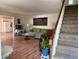 View of the living room featuring hardwood floors and the staircase at 3013 Barcelona Way, Conyers, GA 30012