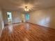Spacious main bedroom with hardwood floors and access to the main bathroom at 3013 Barcelona Way, Conyers, GA 30012