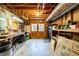 An unfinished basement with wooden beams, exposed pipes, and lots of storage space at 1828 Kellogg Creek Rd, Acworth, GA 30102