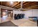 Finished basement area with computer setup, desk, chairs, and exercise equipment at 1828 Kellogg Creek Rd, Acworth, GA 30102