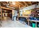 Spacious basement workshop featuring open ceiling, work bench, and storage at 1828 Kellogg Creek Rd, Acworth, GA 30102