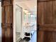 Bathroom with dual barn doors, double vanity, tile flooring, and a glass shower at 1828 Kellogg Creek Rd, Acworth, GA 30102