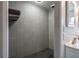 This tiled bathroom features a shower with modern fixtures and clean design at 1828 Kellogg Creek Rd, Acworth, GA 30102