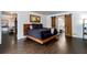 Modern bedroom with dark bedding, a barn door to the bathroom, and hardwood floors at 1828 Kellogg Creek Rd, Acworth, GA 30102