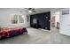 An open concept room with a bedroom featuring a black accent wall and a doorway at 1828 Kellogg Creek Rd, Acworth, GA 30102