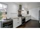 Updated kitchen featuring white cabinets, stainless steel appliances, and a wine refrigerator at 1828 Kellogg Creek Rd, Acworth, GA 30102