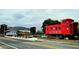 Acworth's quaint charm is displayed in this street view with the town's name emblazoned on a red train car at 1828 Kellogg Creek Rd, Acworth, GA 30102