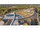 An aerial view of a beautiful park, with a pond, open spaces, walking paths, and well-designed parking at 2210 Hamstead Ct, Suwanee, GA 30024