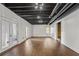 Spacious finished basement with exposed ductwork, wood-look floors, and access to the backyard at 2210 Hamstead Ct, Suwanee, GA 30024