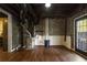 Finished basement area features a brick accent wall and access to a glass panel back door at 2210 Hamstead Ct, Suwanee, GA 30024