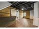 Finished basement with bar area with wood accents and sliding barn door at 2210 Hamstead Ct, Suwanee, GA 30024