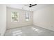Bedroom features neutral carpet, window with blinds, and neutral paint at 2210 Hamstead Ct, Suwanee, GA 30024