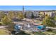 Aerial view of City Hall with a water fountain and shade structures in the square at 2210 Hamstead Ct, Suwanee, GA 30024