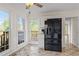 Eat-in kitchen features a black refrigerator and windows offering a scenic view at 2210 Hamstead Ct, Suwanee, GA 30024