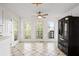 Bright kitchen features black fridge and natural light, providing a pleasant cooking environment at 2210 Hamstead Ct, Suwanee, GA 30024