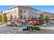 Vibrant street view of local shops featuring outdoor dining and pedestrian-friendly walkways at 2210 Hamstead Ct, Suwanee, GA 30024
