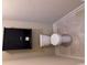 Neutral bathroom featuring tile floor, toilet, and dark cabinet at 3622 Foxtrot Nw Trl, Kennesaw, GA 30144