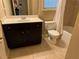Bathroom with toilet, vanity with a white countertop, and a bathtub with shower at 3622 Foxtrot Nw Trl, Kennesaw, GA 30144