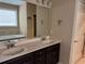 Main bathroom with double sink vanity, soaking tub, neutral paint and tiled floors at 3622 Foxtrot Nw Trl, Kennesaw, GA 30144