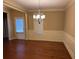 Formal dining room with classic chandelier and wainscoting at 3622 Foxtrot Nw Trl, Kennesaw, GA 30144