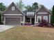 Inviting one-story home with two-car garage, and tidy lawn, exhibiting classic suburban charm at 3622 Foxtrot Nw Trl, Kennesaw, GA 30144