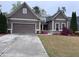 Inviting one-story home with two-car garage, and tidy lawn, exhibiting classic suburban charm at 3622 Foxtrot Nw Trl, Kennesaw, GA 30144