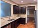 Galley style kitchen with stainless steel appliances and granite countertops at 3622 Foxtrot Nw Trl, Kennesaw, GA 30144