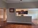 Kitchen area provides a transition into an adjoining room for modern living and entertaining at 3622 Foxtrot Nw Trl, Kennesaw, GA 30144
