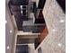 Modern kitchen with stainless steel appliances and granite countertops with dark cabinets at 3622 Foxtrot Nw Trl, Kennesaw, GA 30144
