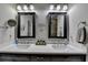 Bright bathroom featuring double sinks with framed mirrors and modern fixtures at 4007 Dunwoody Trce, Atlanta, GA 30338