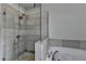 Bathroom showcases walk-in glass shower and separate soaking tub at 4007 Dunwoody Trce, Atlanta, GA 30338