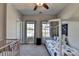 Comfortable bedroom with space themed decor, two windows, and a ceiling fan at 4007 Dunwoody Trce, Atlanta, GA 30338