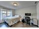 Bright bedroom with hardwood floors, large window, and a dedicated workspace at 4007 Dunwoody Trce, Atlanta, GA 30338