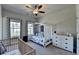 Comfortable bedroom with space themed decor, two windows, and a ceiling fan at 4007 Dunwoody Trce, Atlanta, GA 30338