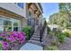 Brick steps leading to the entrance, framed by vibrant flowers and lush greenery at 4007 Dunwoody Trce, Atlanta, GA 30338