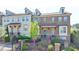 Charming brick townhome with manicured front yard and black iron fence at 4007 Dunwoody Trce, Atlanta, GA 30338