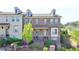 Beautiful brick townhome featuring dormer windows and manicured landscaping at 4007 Dunwoody Trce, Atlanta, GA 30338