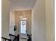 Foyer with natural light, decorative light fixture, and tiled floor at 4007 Dunwoody Trce, Atlanta, GA 30338